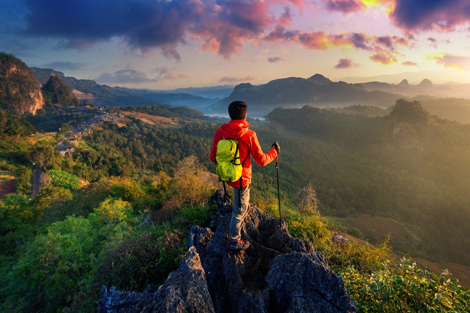 Backpacker standing on sunrise viewpoint at